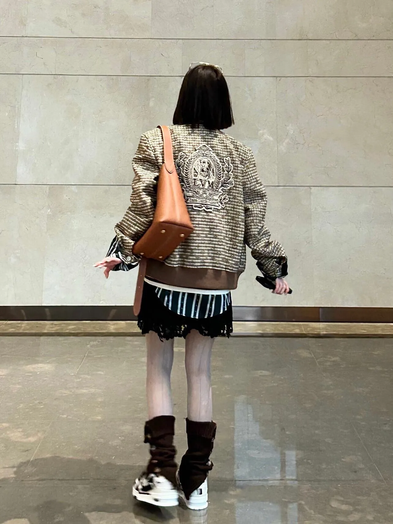 Louis Vuitton jacket with embroidered badges and all-over monogram print.